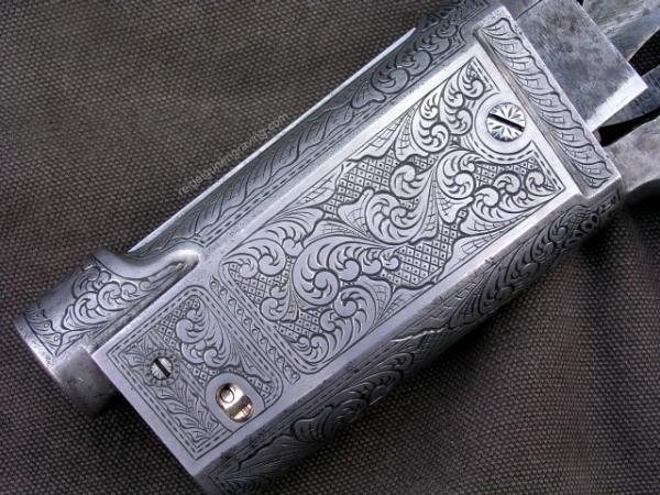 Savage Model 99, engraved by Dennis Reigel, reigelgunengraving.com